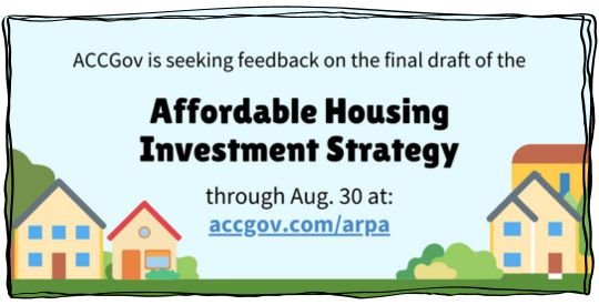 Simple graphic of colorful homes on a blue sky