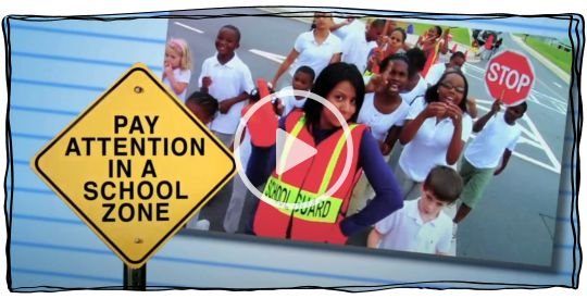 Crossing guard dancing with a group of children