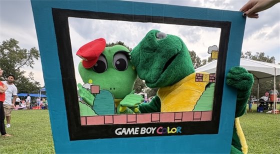 Lily Anne Phibian and Tortuga the Turtle pose at the Athens Water Festival