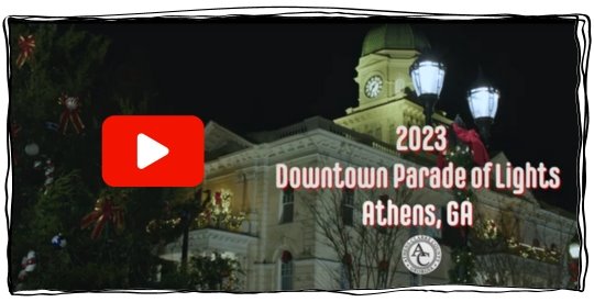 City Hall decorated for the season next to the community Christmas tree.