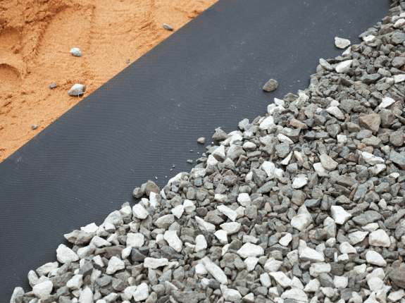 Riprap rock on top of geotextile fabric.