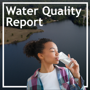 Water Quality Report. Young female drinking a glass of water. Large lake in background.