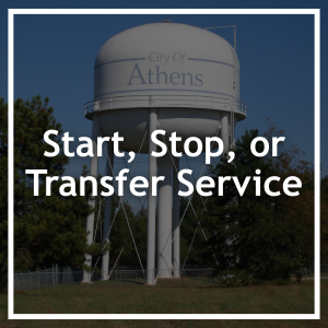 Start, Stop, Or Transfer Service. Outdoor water tower with City of Athens painted in blue. 
