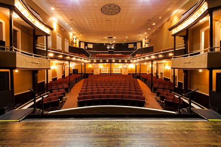 View of the theater seating as seen from the stage.