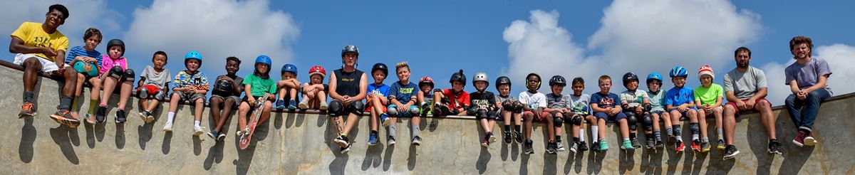 Skate Camp participants sitting on the side of the bowl