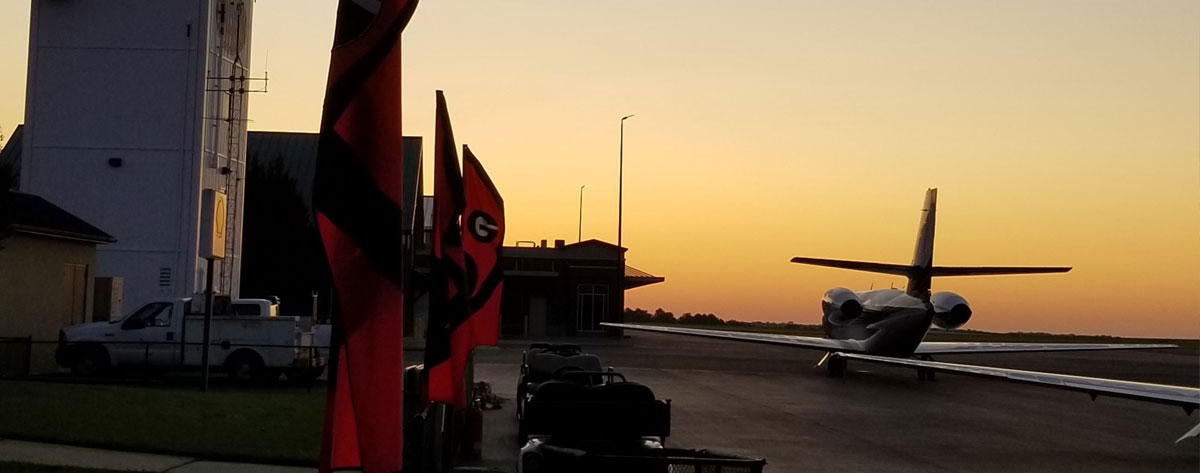 University of Georgia gameday at sunset with jet in the foreground