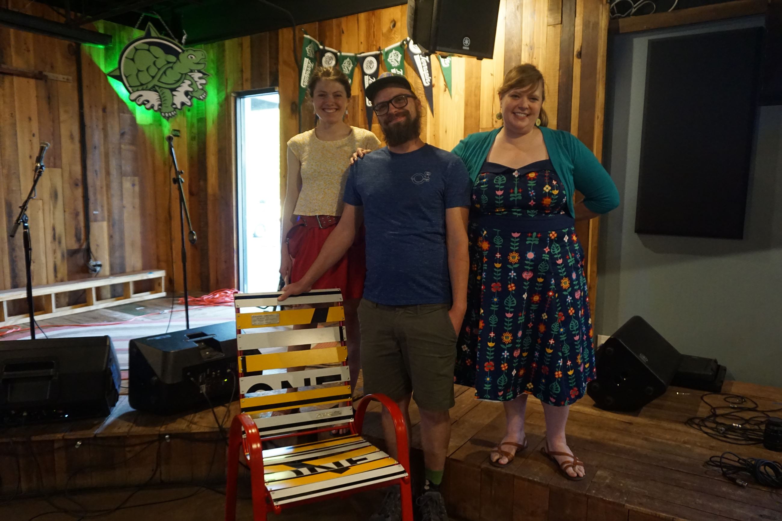 Jacob Yarbrough on behalf of Creature Comforts receives the 2022 Waste Reduction Business Award from