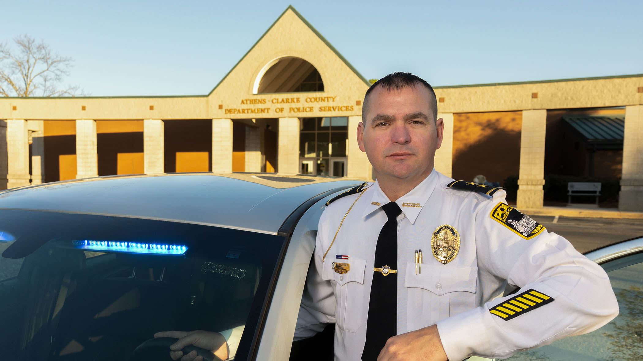 Chief_Saulters_Standing_at_Car