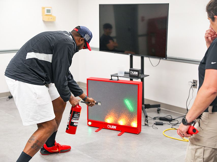 A photo of the extinguisher training device in use.