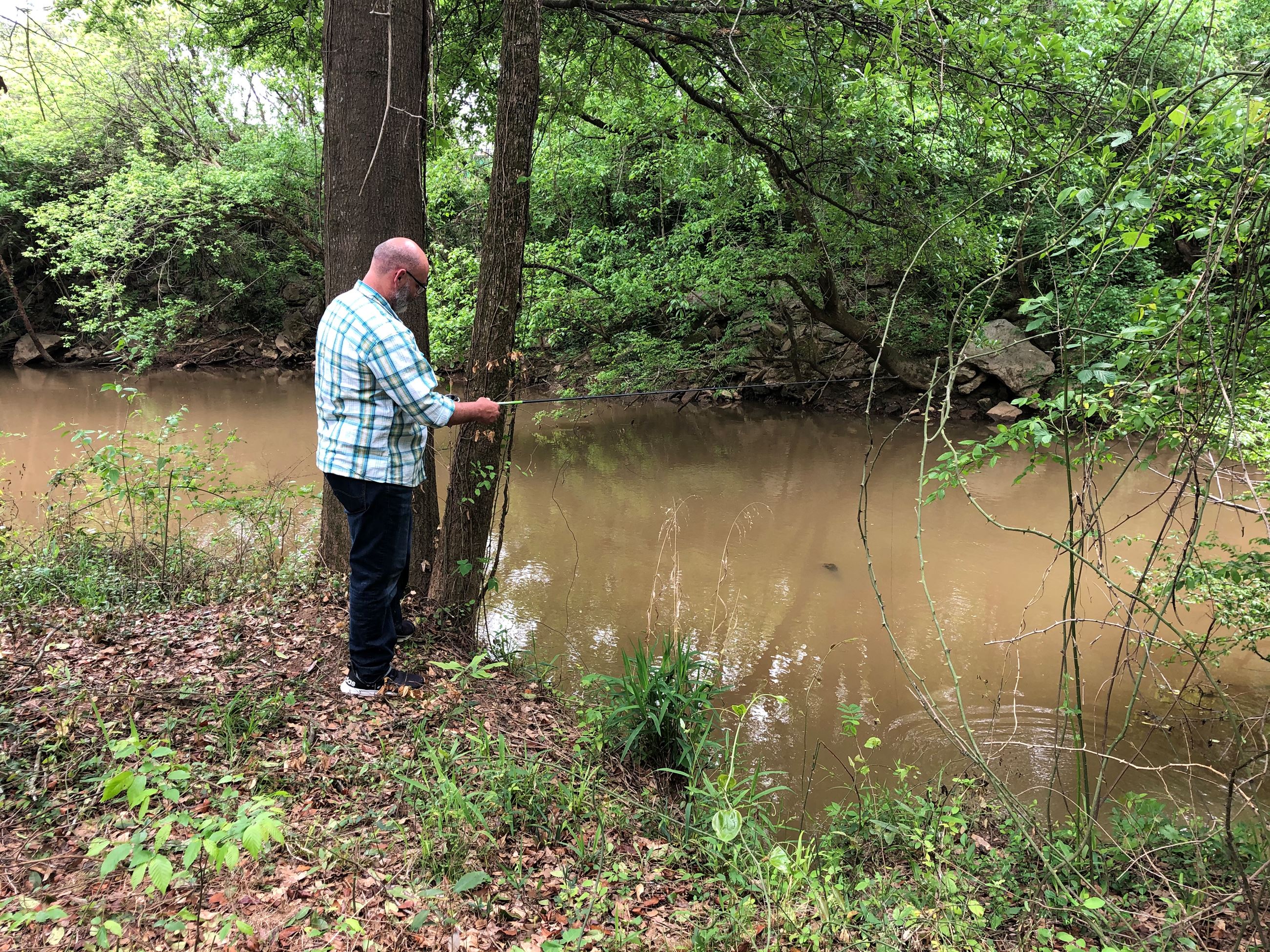 Man fishing in Oconee River